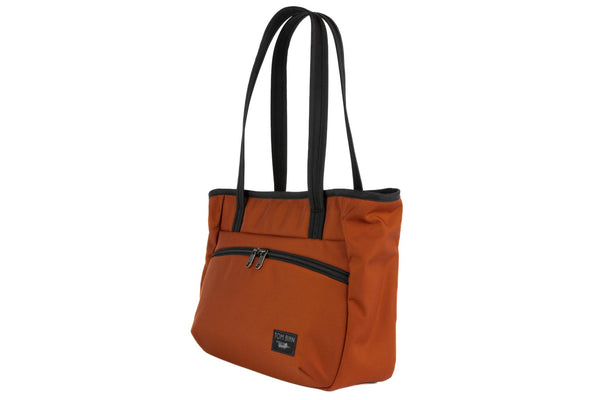 Photo of the Nomad Tote in Burnt Orange Ballistic.